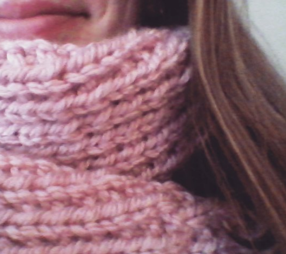 Picture of a pink knitted scarf