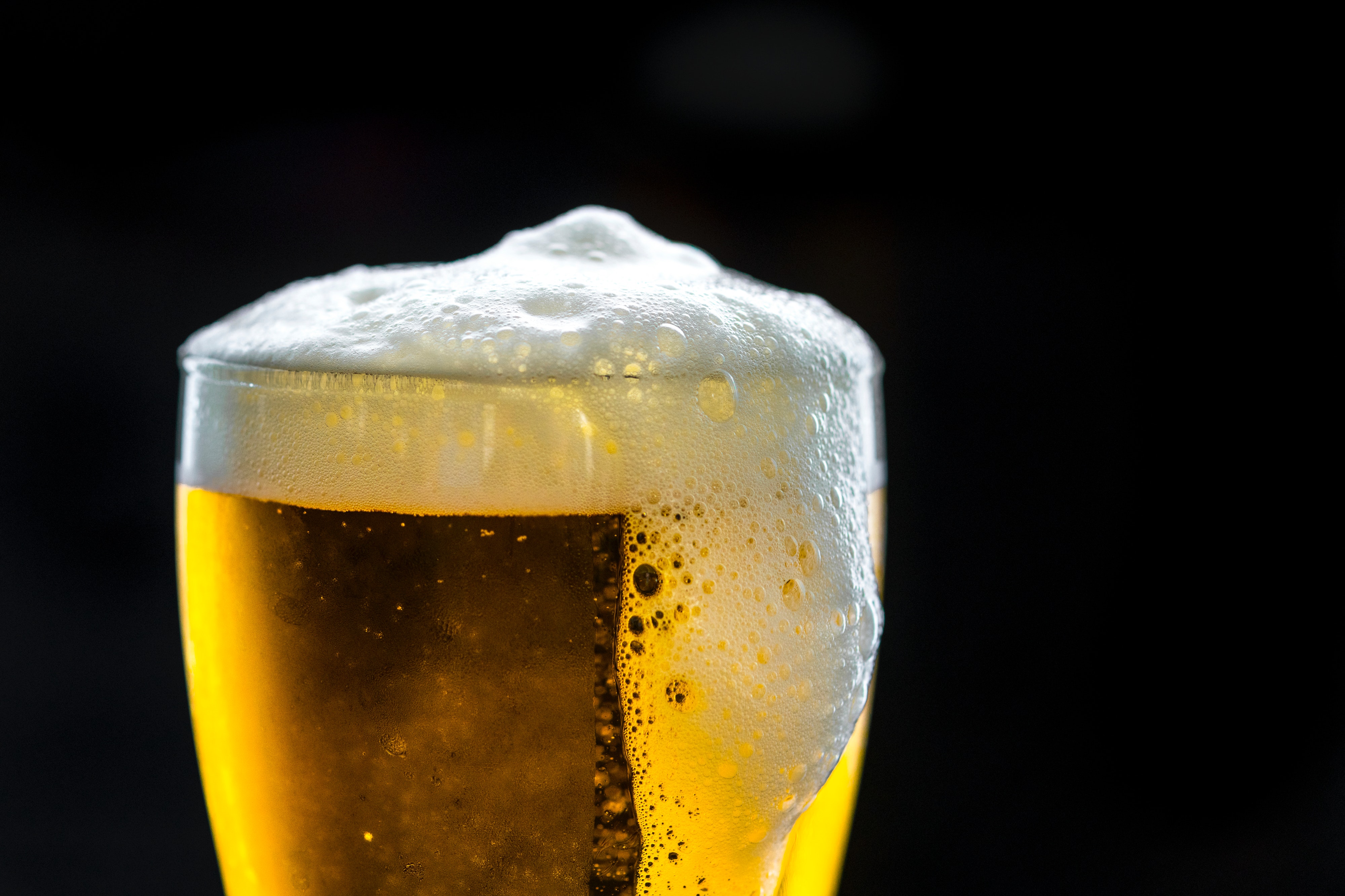 A foaming glass of beer