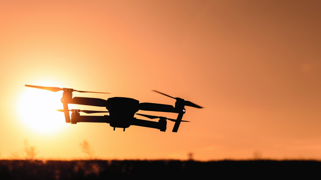 Photo of a drone against the sunset